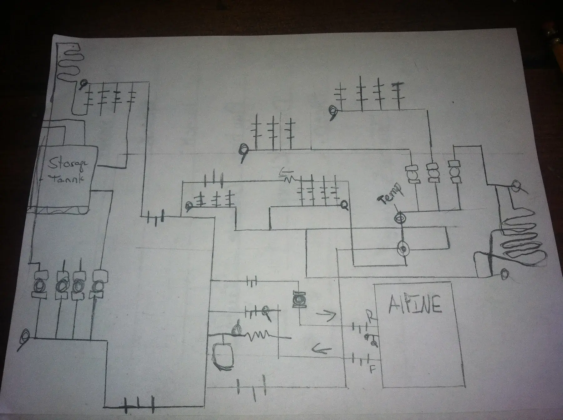 Hand-drawn plumbing and heating system plan on paper
